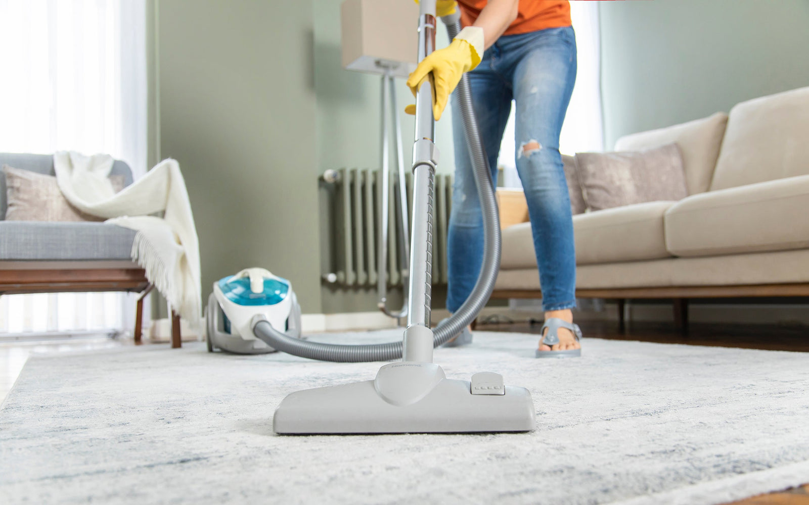 person vacuuming a living room