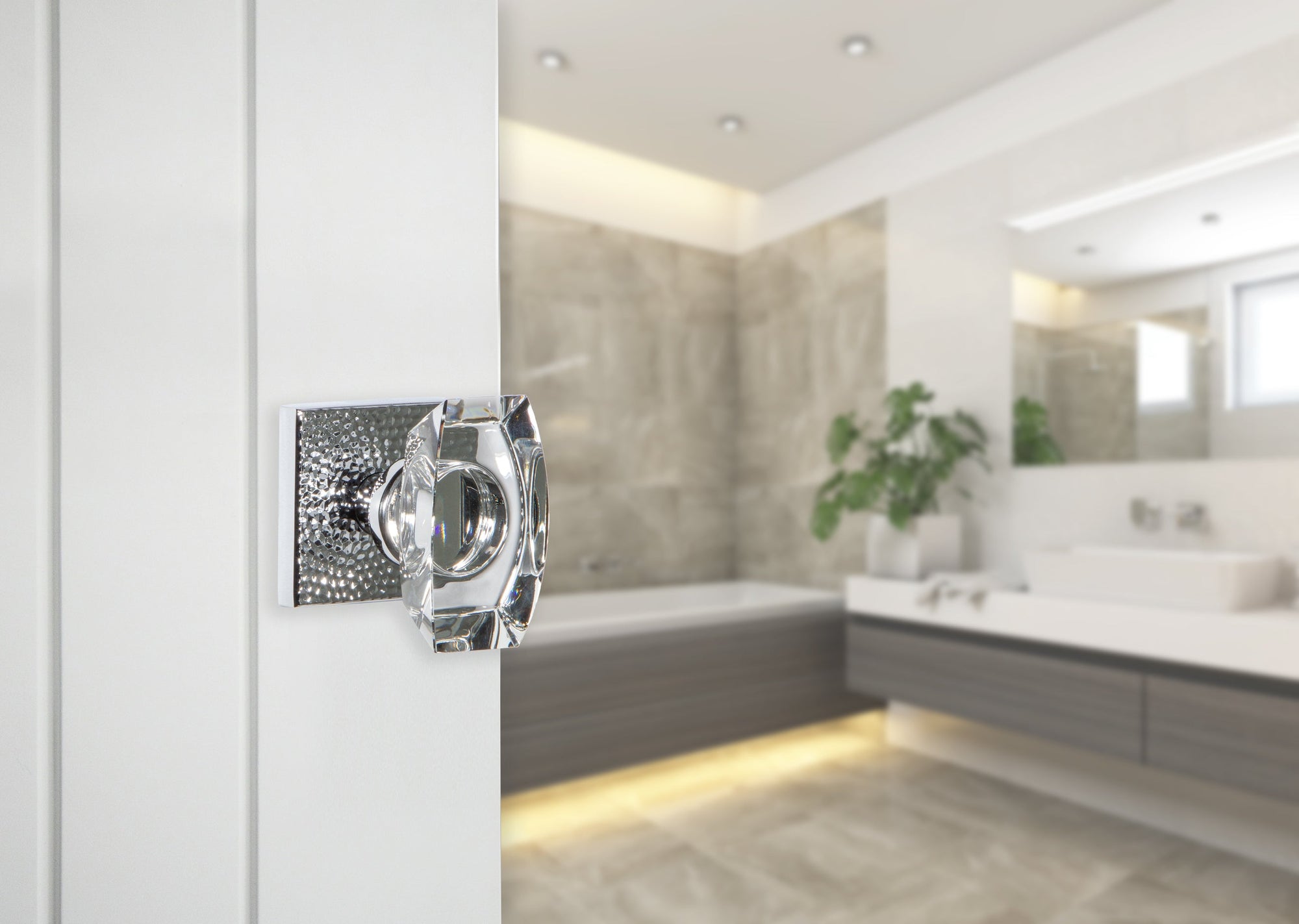 bright white modern contemporary clean bathroom with bright chrome hammered door hardware and crystal doorknob from viaggio 